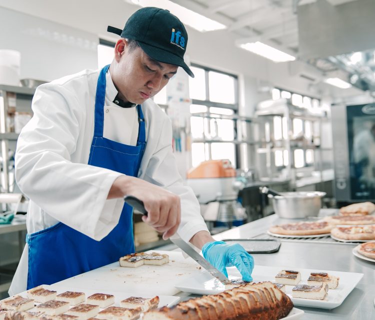 Crew member participating in certified maritime catering and food safety training.
