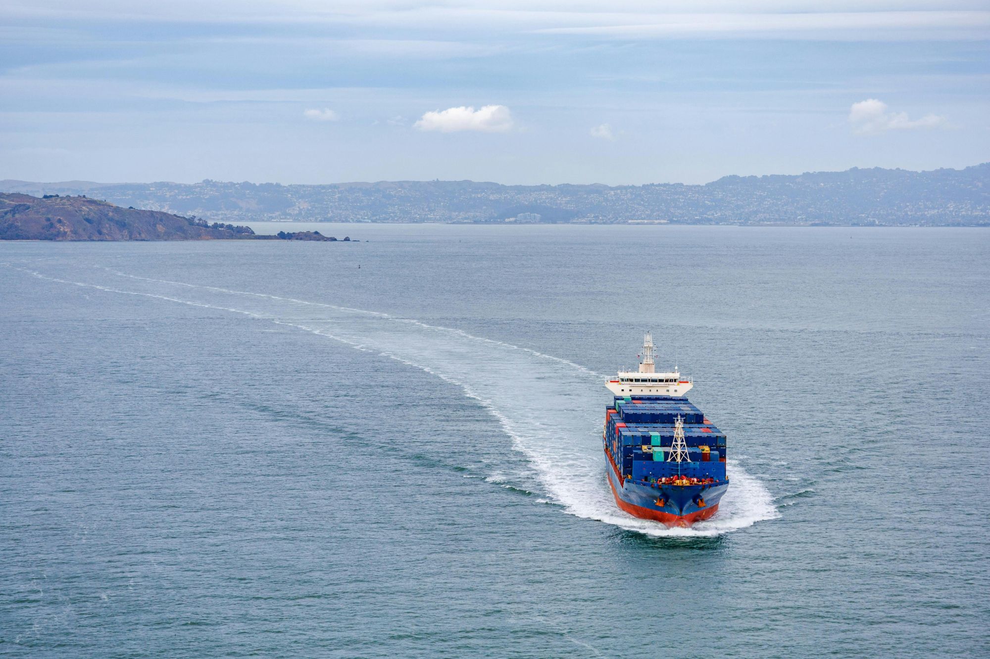 Merchant vessel receiving maritime catering and provisioning services at sea